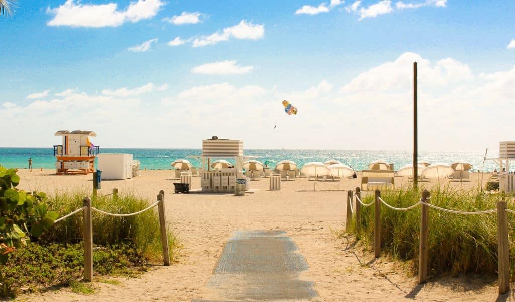 a view of a sandy beach under a blue sky