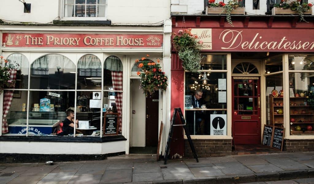 One coffee house sits next to a small-town delicatessen