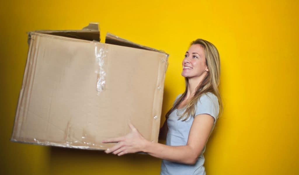 Woman holding a box for packing