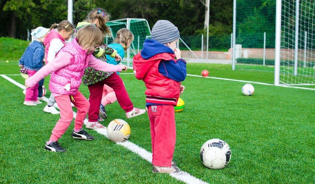 Children playing sports at school