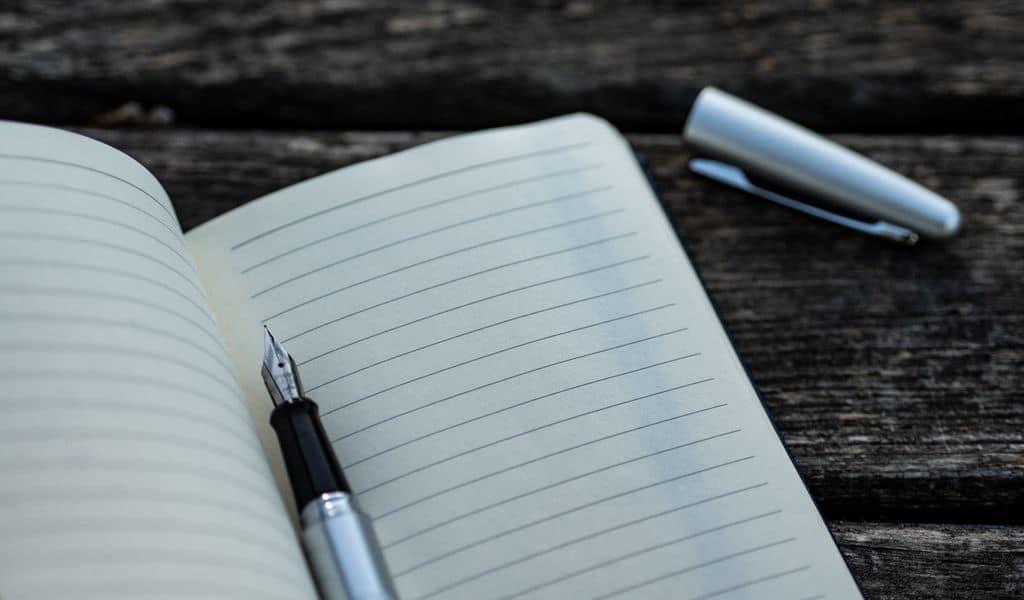 Book and pen on a table