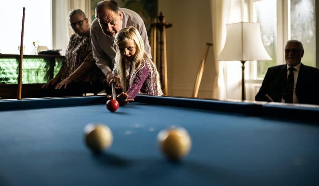 Family playing pool