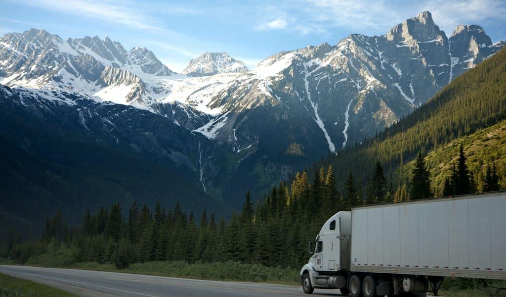 Moving truck travelling through mountainous area