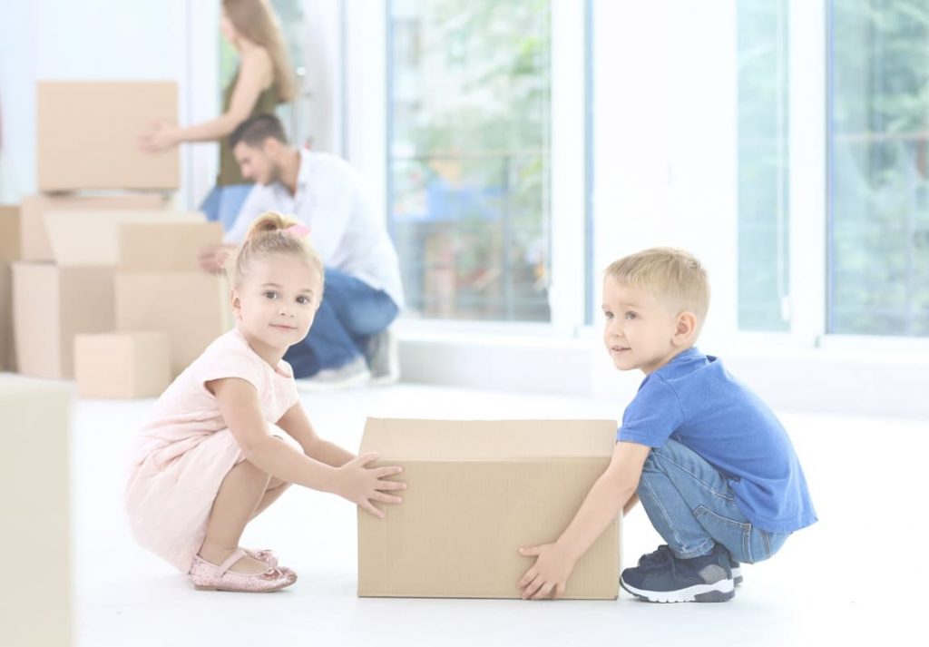 Kids holding a moving box