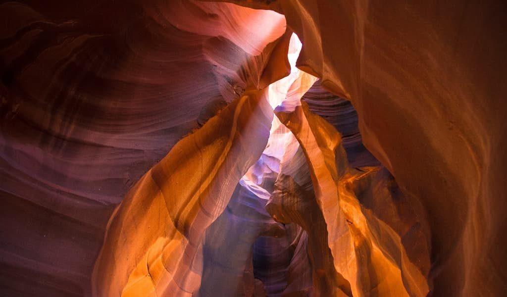 Orange and brown underground caverns with sunlight shining through