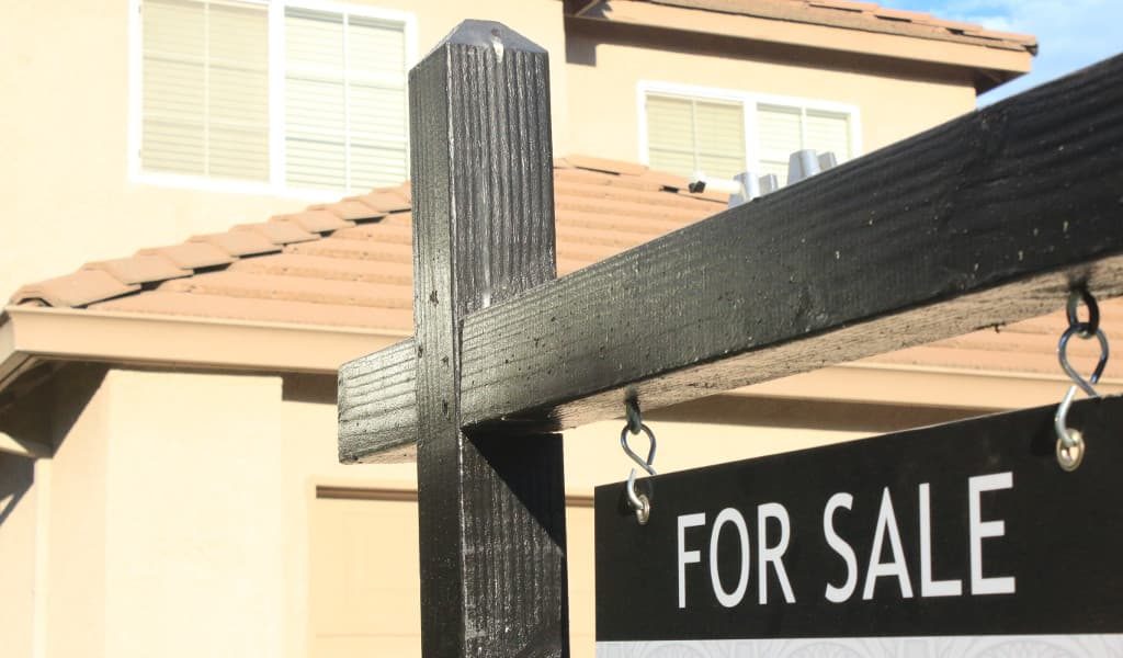 A for sale sign for a house