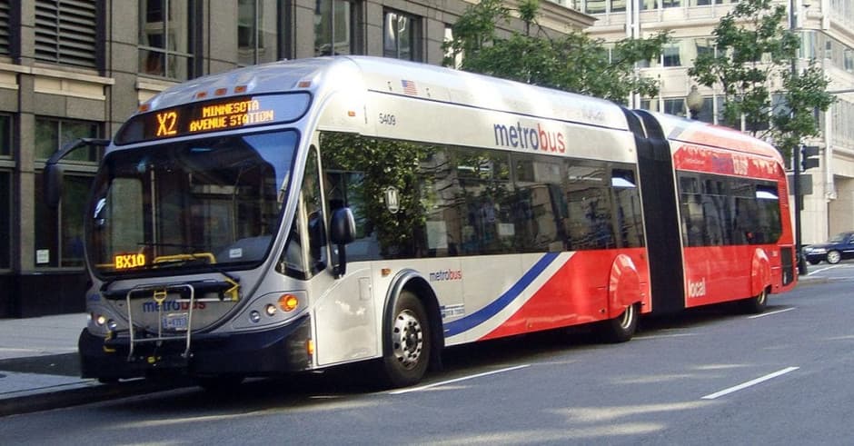 A Metro Bus in Washington red and white in colour