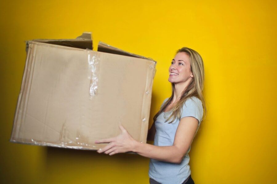 Woman holding box.