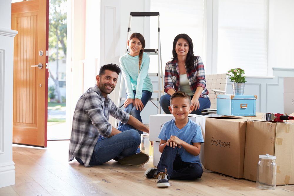 Family and moving boxes