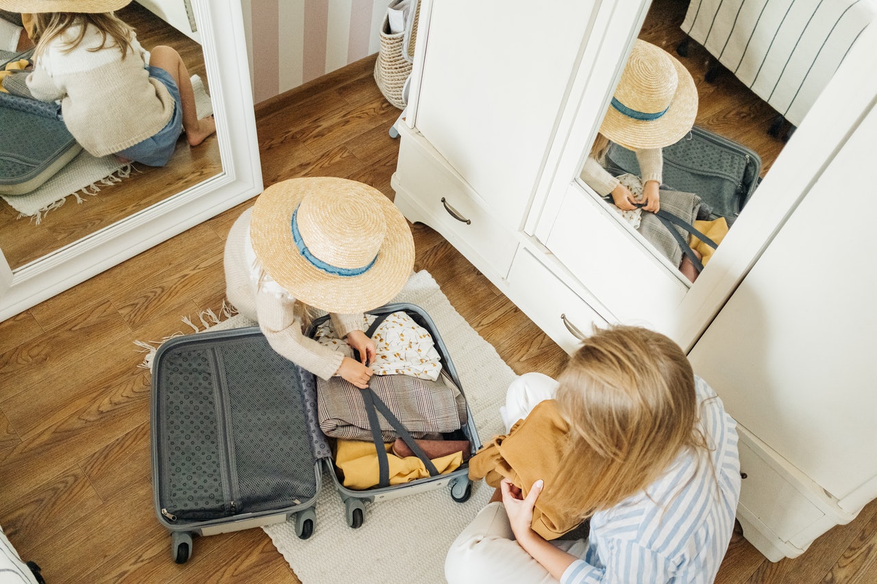 A mother and daughter gathering their belongings